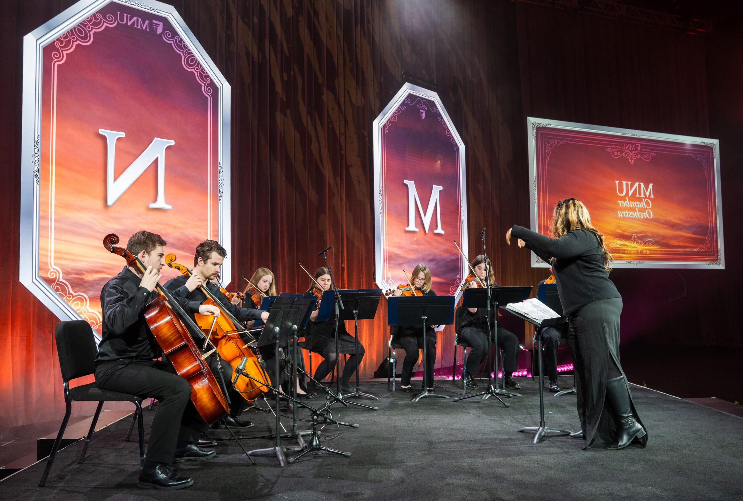 Orchestra playing on stage at 2024 President's Honors